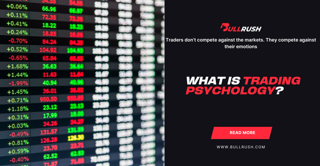 Blurred stock market screen showing green and red numbers, symbolizing trading activity. Text reads "What is Trading Psychology?" with a link to bullrush.com.